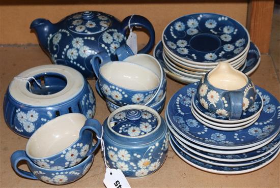 Kahler, Denmark, stoneware part tea set decorated white flowers on a blue ground, signed HAK (24-pce, faults)